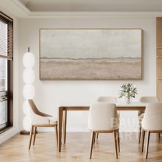 a dining room table with white chairs and a large painting on the wall above it