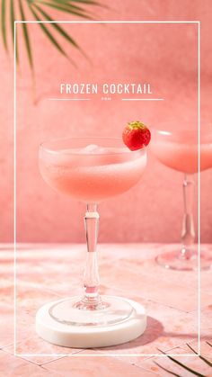 two glasses filled with frozen cocktails sitting on top of a table