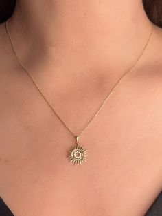 The 14K Solid Gold CZ Sun Necklace is a beautiful and elegant piece of jewelry that makes for an ideal gift for special occasions such as birthdays and anniversaries. Featuring a delicate sunburst design, this minimalist sunshine pendant is both timeless and versatile, adding a touch of sparkle and sophistication to any outfit. Its shiny sun motif, embellished with cubic zirconia (CZ) stones, captures light beautifully, making it a standout accessory. The high-quality 14K solid gold ensures dura Elegant Sun Design Starburst Jewelry, Elegant Starburst Sun Design Jewelry, Starburst Single Cut Diamond Jewelry As Gift, Starburst Single Cut Diamonds Jewelry Gift, Gold Sun Necklace, Sun Motif, Sun Necklace, Gold Sun, Necklace Delicate