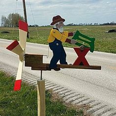 a man on a wooden bench made to look like he is holding a flag