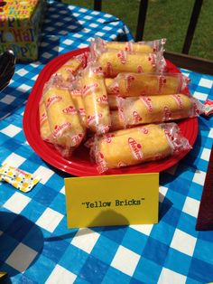 a plate full of yellow bricks sitting on top of a blue and white checkered table cloth