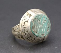 Afghan Turkmen traditional silver mughal hand made ring. Beautiful Arabic scripture, compressed Malachite stones and partial gold wash. Please do not hesitate to contact if you have any questions about items or further information. Measures :  Size of the ring : 8 US Jewelry Ring Mandrel, Weight : 7.4 Grams, Shipping & Estimated Delivery Time With Turkish Registered Post, Destination CountryStandard Shipping (business days) United States          15-20  Europe7-15 Asia15-25  Australia15-20 Brazi Traditional Carved Rings For Ceremonial Occasions, Traditional Carved Ceremonial Rings, Traditional Sterling Silver Engraved Ring For Ceremonial Occasions, Traditional Silver Signet Ring For Ceremonial Use, Traditional Sterling Silver Rings With Inlay, Traditional Handmade Signet Ring For Ceremonial Use, Traditional Handmade Round Signet Ring, Traditional Hallmarked Engraved Ceremonial Ring, Traditional Ceremonial Engraved Hallmarked Ring