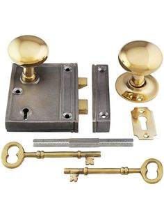 an assortment of brass door handles and knobs with keyed alike locks on white background