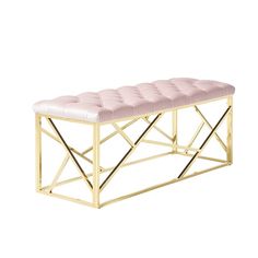 a pink bench with gold metal frame and leather seat pad on the bottom, in front of a white background