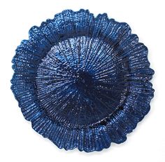 a blue glass plate sitting on top of a white table