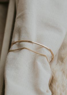 A close up look at a gold cuff bracelet in the Tides Cuff style from Hello Adorn Mixed Metal Bracelets, Copper Uses, Everyday Wear Jewelry, Handmade Jewelry Designs, Circle Studs, Hand Shapes, Silver Shop, Herkimer Diamond, Freshwater Pearl Necklaces