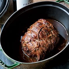 a pot with some meat in it on a table