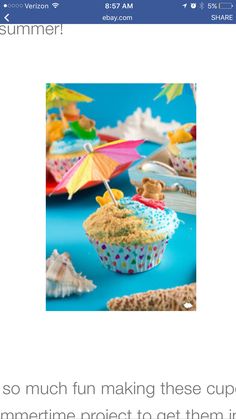 a cupcake with an umbrella on it sitting in front of some other food items