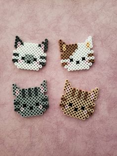 four perler beads with cats on them