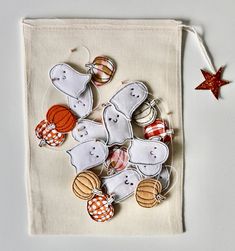 a white bag filled with halloween decorations on top of a table