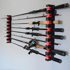 there are many fishing rods hanging on the wall