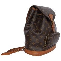 Authentic Louis Vuitton Brown Monogram Montsouris Backpack Mm (Medium size). Features monogram canvas with leather trim, front zippered pouch, top string closure with buckle front flap, the interior has a brown textile lining with slip pocket, adjustable shoulder straps. This bag is perfect for shopping, travel, school, and hands-free needs. Unisex bag! Authenticity Date Code: SP0024 Made in France Strap Drop: (adjustable) Montsouris Backpack, Pre Owned Louis Vuitton, Louis Vuitton Brown, Zippered Pouch, Bag Packaging, Monogram Canvas, Zipper Pouch, Leather Trims, Front Zipper