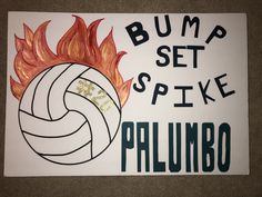 there is a sign that says bump set spike and a volleyball ball on fire in front of it