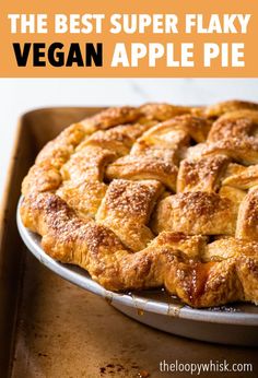 the best super flaky vegan apple pie on a baking sheet with text overlay