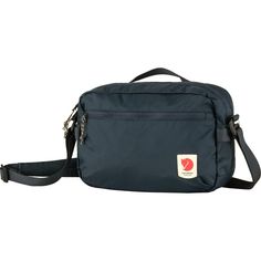 The Fjallraven High Coast Crossbody Bag gives us a premium travel bag, gear bag, or toiletry kit with plenty of pockets and PFAS-free materials that pose less threat to us and the planet. The recycled fabric has been treated with a durable water repellent to shed stains and light moisture, protecting our packables on our trip or daily commute. The bag's exterior features a zippered front pocket for our easy access items while the interior holds two mesh sleeves, a zippered organizational pocket, Affordable Everyday Bags By The North Face, Country Road Cross Body Bag, Fjallraven High Coast, Kanken Mini, Gear Bag, Black Crossbody, Pocket Bag, Black Cross Body Bag, Online Bags