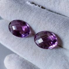 Elevate your jewelry game with our exquisite 16x12mm Amethyst Oval Briolette Pair. Handpicked for quality, these gemstones add a touch of luxury to your creations. Perfect for earrings or pendants, these top-grade amethysts ensure your pieces stand out. Invest in timeless elegance with our briolette pair today STONE NAME: Amethyst CUT: Bolivian  GRADE: AAA COLOR: Purple SIZE: 16X12 MM SHAPE: Oval Briolette  CARAT WEIGHT: 15.95 CTS NO. OF PIECES: 2 Pcs CUT: Excellent  CLARITY: VVS  NATURAL/LAB-CR Elegant Purple Oval Gemstones, Classic Purple Oval Gemstones, Luxury Purple Oval Gemstones, Oval Multi-stone Amethyst Gemstones, Oval Purple Natural Gemstones, Fancy Earrings, Jaipur India, Amethyst Stone, Stone Earrings