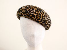 An elegant beret made of leopard printed wool felt. Round shape, no lining.  Very light to wear.    Would you like to wear it with a black turtle knit and red lips, or simple little black dress,  or chunky white wool knit?  Styling imagination will be infinite for this beret! Size Diameter 26cm round shape Height 10cm Size M 57cm  L 59cm An adjustable belt inside.   Ready to ship. Shipping would be EMS, it takes about 4-5days to the US or the UK, 7-14 days to Europe, 2- 3 days to China, and 4- 5 days to rest of Asia and Oceania. It depends on the customs. Fitted Wool Beret With Short Brim, Felt Beret, The Gentlemen, Beautiful Hats, Wool Knit, Berets, Leopard Pattern, Adjustable Belt, Red Lips