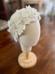 a white headpiece on a wooden table