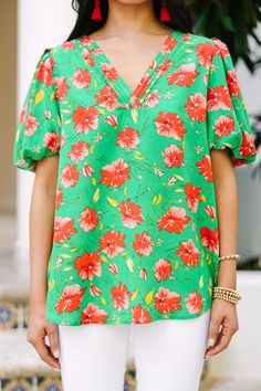 Feel feminine and have fun with your style in the All You Green Floral Top! Super cute, with its vibrant green coloring and cute floral print, this work blouse will have you feeling flirty and ready to take on the day. Perfect for spring and summer, you'll be blooming in this must-have piece! This blouse features short bubble sleeves, a v-neckline with pleated detailing, a floral print. 
Material has no amount of stretch.Cindy is wearing the small. Green Floral Top, Mint Julep Boutique, Mint Julep, Model Fits, Vibrant Green, Work Blouse, Floral Top, Have Fun, Floral Tops