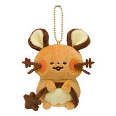 a brown and white stuffed animal hanging from a chain