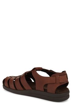 This fisherman sandal made with textured leather straps is well cushioned with a latex foam footbed for comfort and support. Adjustable strap with buckle closure Foam-cushioned footbed Leather upper/leather and textile lining/rubber sole Imported