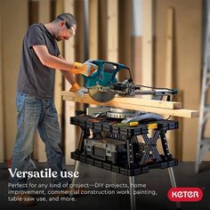 a man working on a table sawing with the help of an electric driller