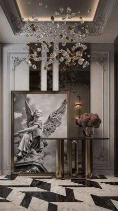 an elegant foyer with chandelier and artwork on the wall, marble flooring