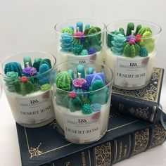 four candles are sitting on top of a book