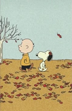 a charlie brown and his dog are in the fall leaves