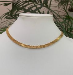 Stunning necklace signed by MONET. In shiny gold tone textured setting, with beautiful design! Very elegant, rare find, push in clasp! Marked Monet. 16 1/2 inches long from end to end! Excellent condition! It comes from a private collection!  PLEASE look at ALL pictures for measurements and condition as they are a very important part of the description, and what you will receive! Pictures are made with different light! Please note that this is sold "As Is", no returns please! The Link to my shop is: https://www.etsy.com/shop/MyWildWork Formal Gold Herringbone Necklace With Adjustable Chain, Gold Vintage Choker With Clavicle Chain, Gold 16 Inch Choker Necklace, Gold Chain Necklace 16 Inch, Gold Choker Necklace 16 Inch Length, Gold Clavicle Chain Costume Choker, Gold Costume Jewelry Choker With Clavicle Chain, Elegant Gold Herringbone Choker Necklace, Gold Clavicle Snake Chain Choker