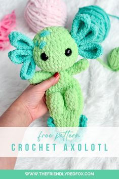 a hand holding a crochet stuffed animal with the words free pattern on it