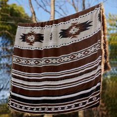 Add a touch of rustic artistry to your home with our new brown Aztec faux fur blanket – perfect for cuddling up in style! #aztecblanket #rusticartistry #cozyhome