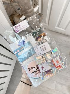 a stuffed animal sitting on top of a pile of cards