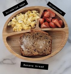 a wooden plate topped with different types of food