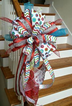 a large red, white and blue bow on the stairs