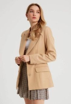 A rockstar blazer meets pure sophistication in this women's designer light camel blazer. This piece has a luxe peak lapel, functional buttoned front and generously padded shoulders that will enhance any outfit. Add this classic piece to your wardrobe revamp for next time you're dressing up for that big promotion at work or heading out on the town Product Features - Pure sophistication written all over it - Comes with luxe peak lapels and functional buttonfront - Padded shoulder adds comfort, sup Classic Beige Double-breasted Blazer, Neutral Business Blazer With Button Closure, Beige Office Blazer With Button Closure, Beige Double-breasted Blazer With Suit Collar, Tailored Beige Blazer Dress For Business, Tailored Beige Blazer With Button Closure, Beige Double-breasted Blazer For Workwear, Beige Notch Lapel Blazer Dress For Office, Neutral Suit Collar Blazer For Work