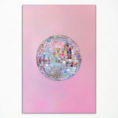 a disco ball is floating in the air on a pink and blue background with white border