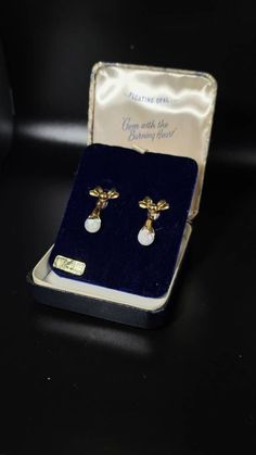 Beautiful Rare vintage Bow style floating opal earrings. Earrings are gold filled(stamps). Earrings are screwball. Original vintage case included! 100percent Genuine opal Any questions or concerns please let us know. Australian Opal Pendant, Bow Style, Opal Earrings, Australian Opal, Opal Pendants, Screw Back Earrings, Opal Necklace, Aurora, Gold Filled