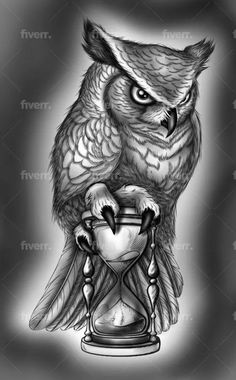 an owl sitting on top of a hourglass