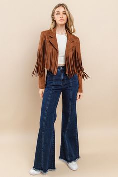 Elevate your style with our Fringed Suede Jacket! Made from high-quality suede, this jacket features beautiful fringe detailing that adds a touch of bohemian flair to any outfit. Stay warm and fashionable in this must-have piece. Perfect for any occasion, this jacket is a versatile addition to your wardrobe. This jacket is a true to size fit, this top does not have much stretch, so this is true to size. Model Info: Height: 5'6 Weight: 130lbs Bust: 34D Shoe Size: 8 Bottom: 7 (M) Top: M Product De European Winter Fashion, Fringe Jacket Outfit, European Fashion Winter, European Winter, Timeless Looks, Summer Packing, Fringe Fashion, Suede Moto Jacket, Euro Summer