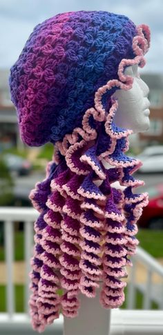 a crocheted hat on top of a mannequin head