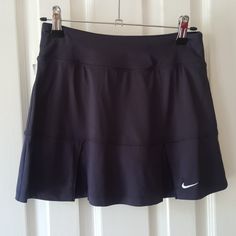 Never Worn! Nike Dri-Fit Charcoal Gray Running Or Tennis Skort. Front And Back Are Pleated For Extra Room. Built In Shorts For Comfort. Never Worn But Tags Are Missing, It's Been Hanging In My Spare Closet. Nike Fitted Tennis Skirt, Nike Pleated Skirt Fitted Bottoms, Casual Nike Fitted Tennis Skirt, Nike Casual Skirted Skort, Stretch Nike Tennis Skirt, Nike Stretch Tennis Skirt, Nike Fitted Pleated Skirt, Nike Fitted Skirt, Fitted Nike Pleated Skirt