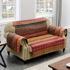 a living room scene with focus on the couch and coffee table in the foreground