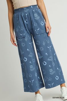 our french terry wide leg elastic waistband pants with graphic print & side pockets! who says style and comfort can't coexist? get ready to kick back and relax in these wide leg pants, complete with an elastic waistband (for indulging in all the snacks). plus, with a graphic print and handy side pockets, you'll be looking and feeling like a fashionista.shop our matching set, french terry graphic printed top!fabric contents & fit notes:• model is 5'9" and is wearing a small.• all measurements are Cotton Wide Leg Pants With Side Pockets For Loungewear, Trendy Cotton Bottoms With Elastic Waistband, Cotton Lounging Pants With Elastic Waistband, Graphic Print Bottoms For Summer Loungewear, Trendy Cotton Bottoms With Comfort Waistband, Casual Printed Cotton Bottoms, Comfortable Cotton Wide Leg Pants With Elastic Waistband, Casual Cotton Printed Bottoms, Trendy Graphic Print Relaxed Fit Pants