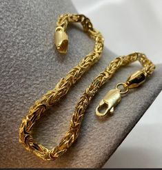 18k Solid gold Byzantine chains, bracelets with Lobster Claw closure for better protection. 3mm thickness. 7.5" & 8" Best birthday/anniversary gift. Real gold for your loved ones. *18k Solid gold Byzantine bracelet, 7.5 inches length, 3mm & 16.5 grams, 0.582 oz* *18k Solid gold Byzantine bracelet, 8 inches length, 3mm & 18 grams, 0.635 oz* *750 Certified, stamped* Highest quality of gold ONLY REAL GOLD Polished link Byzantine chains are beautifully woven by hand to create an Italian timeless cla Gold Wheat Chain Bracelets As Gift, Yellow Gold Bracelets With Wheat Chain As A Gift, Gold Wheat Chain Bracelet Gift, Gold Wheat Chain Bracelet As Gift, Gold Polish, Jewelry Business, Timeless Classic, Real Gold, Chain Link Bracelet