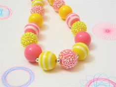 Cute Yellow Round Bead Necklaces, Cute Adjustable Yellow Necklace, Cute Adjustable Yellow Necklaces, Fun Yellow Jewelry For Birthday, Playful Yellow Necklaces With Colorful Beads, Fun Yellow Round Beads Jewelry, Fun Yellow Round Beaded Jewelry, Playful Yellow Beaded Necklaces, Playful Yellow Beaded Necklaces With Colorful Beads