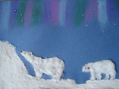 two polar bears are walking across the snow