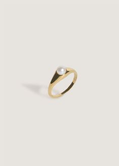 The Pearl Collection. Known as the "Queen of Gems," Akoya Pearls are a traditional symbol of elegance and beauty. We took your favorite Medium Signet Ring and placed a cream-colored Japanese Akoya Cultured Pearl. 14k solid gold – always Pearl is 4mm round Face of the ring measures 7mm x 7mm Ring weighs about 3.5g Pearl care & wear: pearls are organic gemstones, so they're vulnerable to acid, extreme humidity and are not meant to be worn in the shower. We recommend to size up if this ring is thic Pearl Collection, Broken Chain, Solid Gold Rings, Akoya Pearls, Pearl Size, Pearl Ring, Signet Ring, Cultured Pearls, The Queen