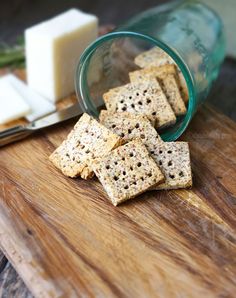 some crackers are sitting on a cutting board