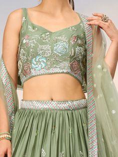 Introducing our stunning sea green embroidered georgette sangeet wear lehenga choli, a perfect outfit for any special occasion. This exquisite ensemble features intricate stonework, sequin detailing, and thread embroidery on both the lehenga and choli. The matching net dupatta completes the look with sequin and thread embroidery, along with designer lace work.
The sea green color of this outfit is elegant and timeless, making it a versatile choice for a variety of events such as receptions, enga Green Georgette Sets With Intricate Embroidery, Green Georgette Lehenga With Unstitched Blouse, Green Georgette Anarkali Set With Unstitched Blouse, Green Embroidered Georgette Lehenga, Embroidered Green Georgette Choli, Green Georgette Choli For Festivals, Festive Green Georgette Choli, Festivals Green Georgette Choli, Green Lehenga With Intricate Embroidery In Georgette